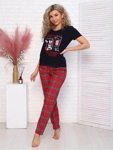 Detail of bunny rock print black T-shirt and red plaid pajama pants for women