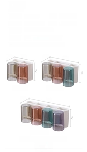 Size chart for wall-mounted toothbrush holder with cups in three different capacities
