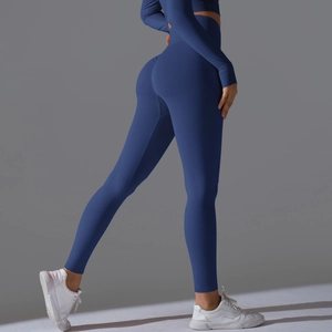Detail view of seamless dark blue yoga set showing ruched butt-lift and ribbed texture