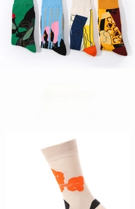Detail of artistic Picasso style cotton socks featuring abstract faces and geometric patterns