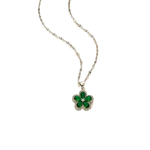 Silver flower pendant necklace with green petals and zircon crystal center on white background