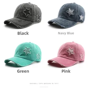 Detail of four vintage washed baseball caps with star patches and distressed edges
