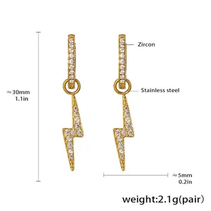 Detail view of lightning bolt earrings with zircons and 18k gold plating details
