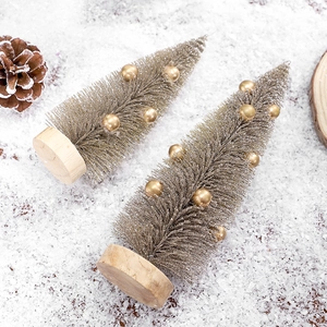 Mini silver pine needle Christmas trees with gold beads and wooden bases in a snow scene