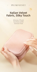 Detail of pink velvet jewelry box showing soft texture and gold zipper hardware