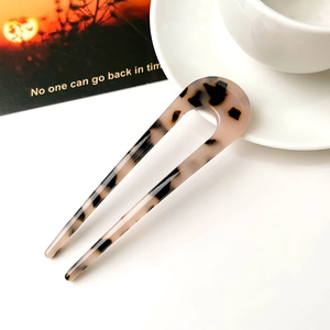 Close-up of leopard print acetate hair fork with glossy finish for elegant hair styling