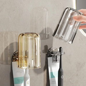 Wall-mounted toothbrush holder set with amber and smoke gray translucent cups