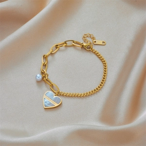 Golden titanium steel chain bracelet with heart shell pendant and white pearl detail