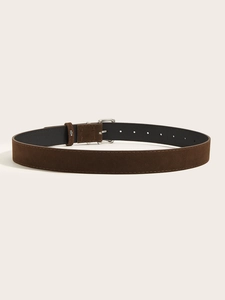 Detail view of dark coffee suede belt with silver buckle and decorative stitching