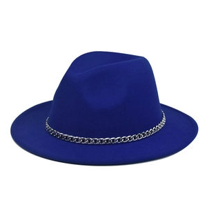 Detail of royal blue wool fedora hat featuring a chunky silver metal chain band