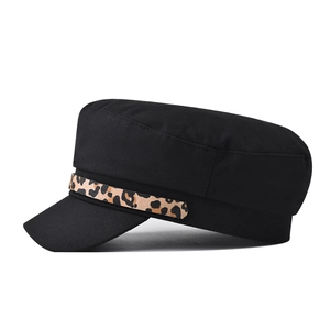 Black cotton flat top baker boy hat featuring a stylish leopard print leather chain band