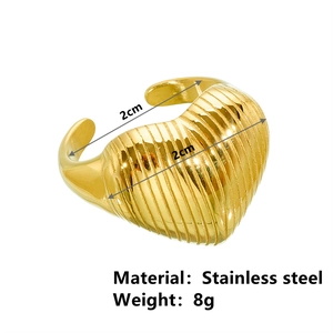 Adjustable golden stainless steel open ring featuring a striped heart design