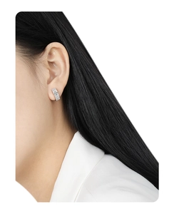 Close-up of S925 sterling silver hoop earrings with micro-pave cubic zirconia on model