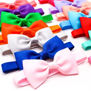 Multiple colorful ribbed ribbon bows for pets and hair accessories neatly arranged