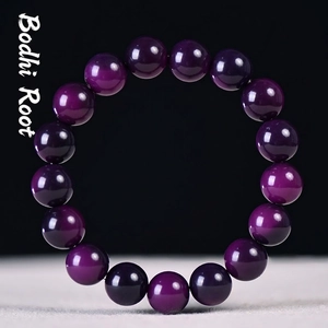 Deep purple Bodhi seed bracelet with polished round beads in a perfect circular display
