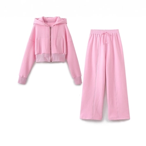 Pink two-piece women's lounge set with cropped zip hoodie and wide-leg sweatpants