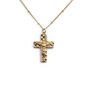 Elegant gold-plated cross pendant necklace with cubic zirconia stones on white background