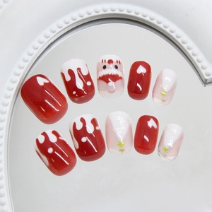Cute Christmas press-on nails with red and white melting snowman and Santa designs