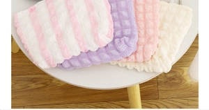 Macro shot of colorful waffle bubble texture fabric bags in soft pastel aesthetic colors