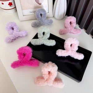 Plush faux fur claw hair clips in various pastel colors for stylish women hair styling