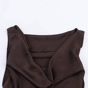 Detail of deep brown satin midi dress showing the elegant cowl neck and silky texture