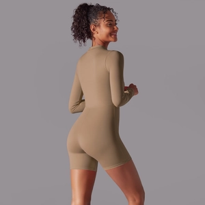 Close-up of seamless coffee brown long sleeve athletic bodysuit for gym and yoga wear