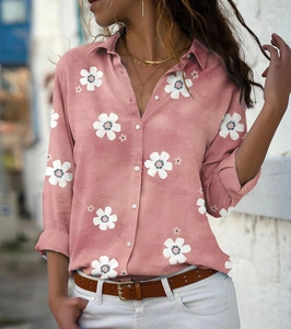 Women's light pink long sleeve shirt featuring white daisy floral print and button-down collar