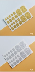 Macro view of gold and silver glitter adhesive toe nail wraps J009 and J010 sets