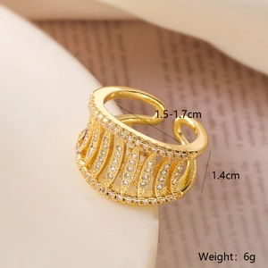 Detail view of gold-plated geometric hollow ring with sparkling zircon inlays