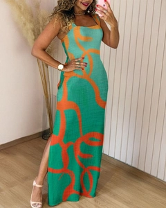 Detail view of the green floral maxi dress featuring a high side slit and abstract print