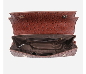 Interior view of brown ostrich texture handbag showing large storage space and pockets