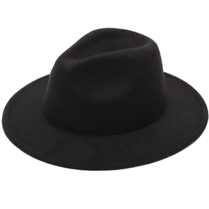 Detailed close-up of a classic black wool felt fedora featuring a stylish wide wavy brim