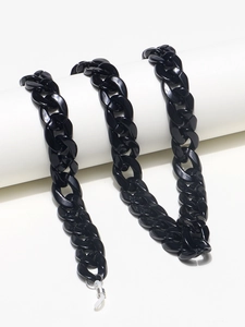 Minimalist black acrylic eyewear chain featuring thick oval links and adjustable silicone loops