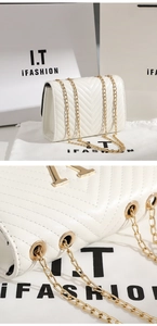 Detailed close-up of white V-quilted leather bag with golden chain and logo