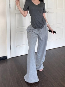 Slim fit dark grey V-neck short sleeve T-shirt paired with light grey wide leg joggers