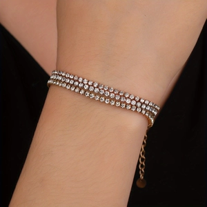 Three-layer gold zircon tennis bracelet for women worn on wrist with adjustable clasp