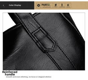 Close-up of black litchi grain leather tote bag with reinforced stitching and handle
