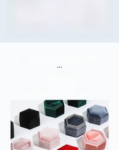 Detailed macro view of hexagonal velvet jewelry boxes showing plush texture and ring slots
