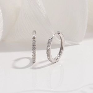 Close-up of S925 sterling silver hoop earrings with shimmering zircon stones