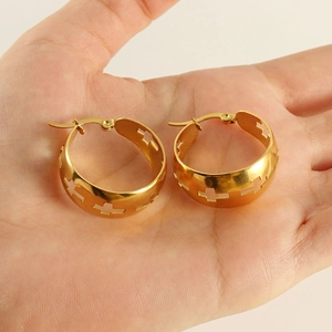 Golden stainless steel hoop earrings featuring minimalist hollow cross patterns for women