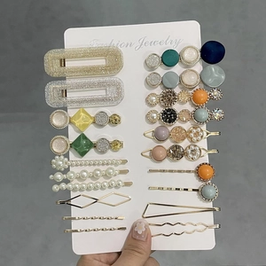 Detailed set of 20 fashion hair clips featuring acetate, faux pearls and gold metal finish