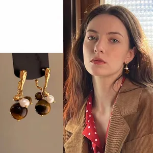 French vintage earrings with gold hammer texture, tiger eye stones, and pearls for women