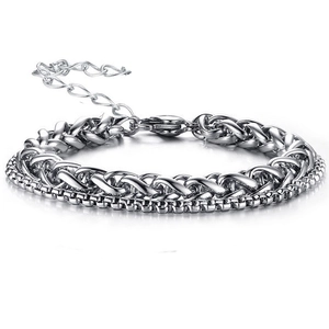 Silver double-layer bracelet with braided chain and bead chain on white background