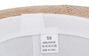 Detail of internal sweatband and size label for the woven paper straw fedora hat