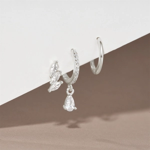 Close-up of 925 sterling silver earring set with marquise zircons and pear charms