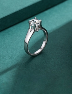 Macro shot of S925 silver ring featuring round zircon in classic four-claw setting