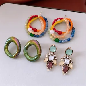Vintage style drop earrings with colorful crystals and bohemian beaded hoop design