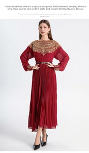 Close-up of golden embroidery and sequins on the collar of a wine red pleated dress