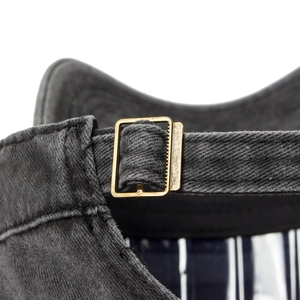 Rear view of vintage washed charcoal flat top cap showing adjustable metal buckle strap