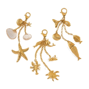 Polished gold ocean-themed charms with starfish, shell and turtle pendants for bags